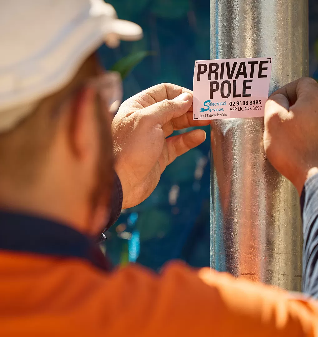Electrician Installs New Electric Poles
