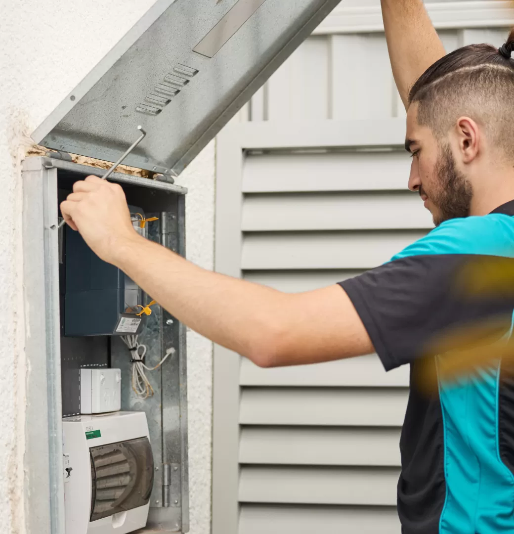 Electrician Opening The Switchboard