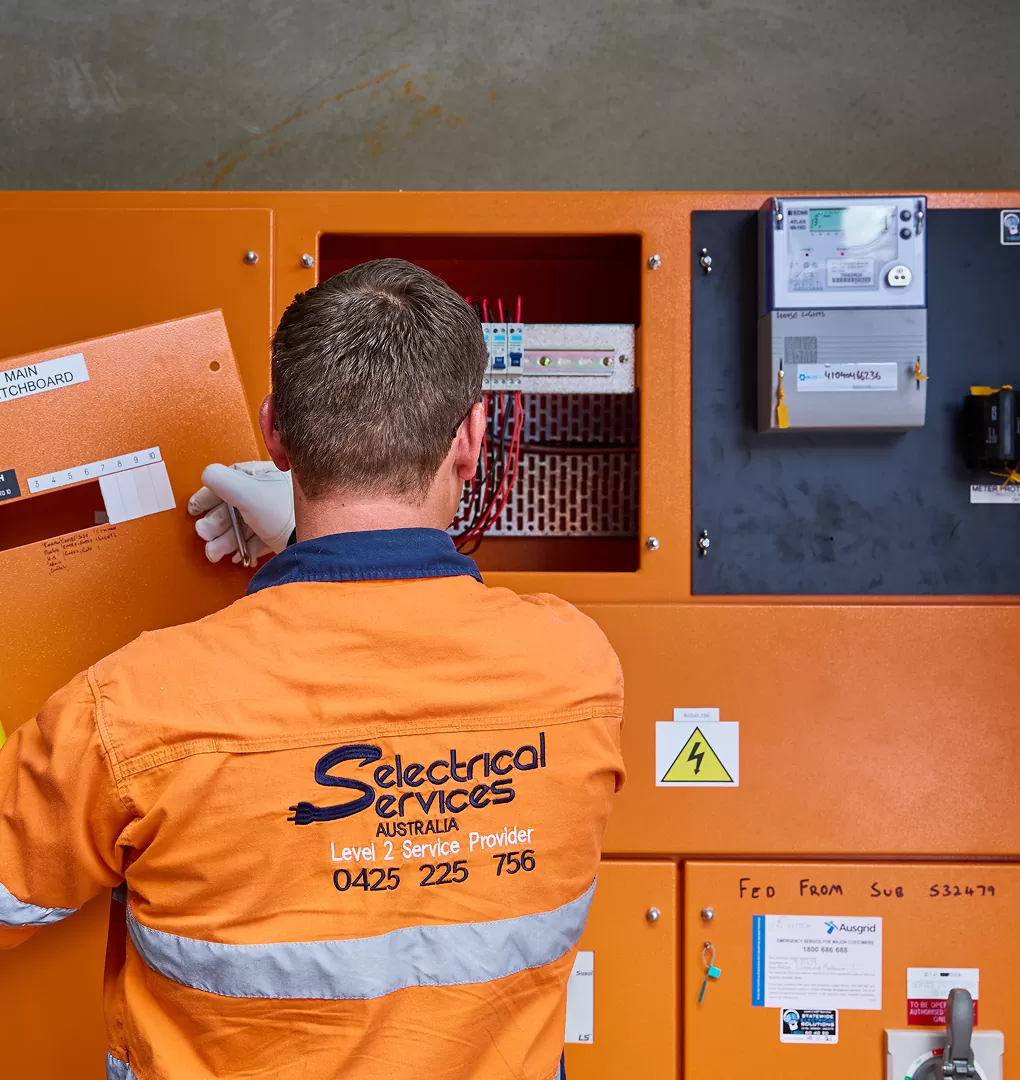 Electrician Working On Switchboard